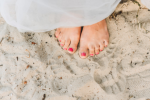 person standing in the sand
