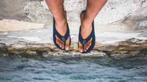 Preventing Toenail Fungus in Public Places: Tips for Healthy Foot Hygiene Outdoors person wearing flip flops